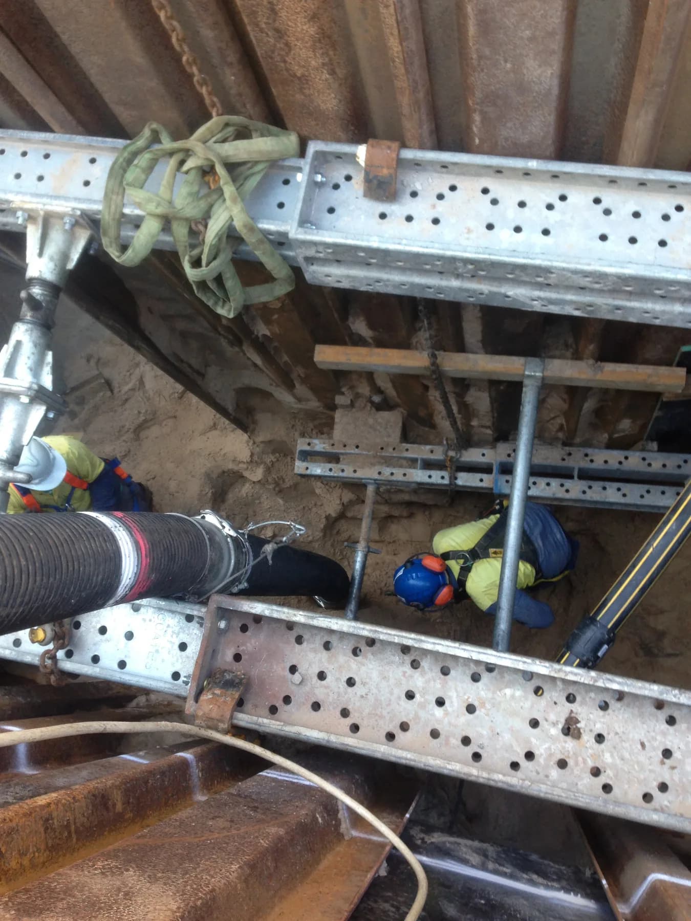 VACIT crew undertaking vacuum work inside a controlled excavation